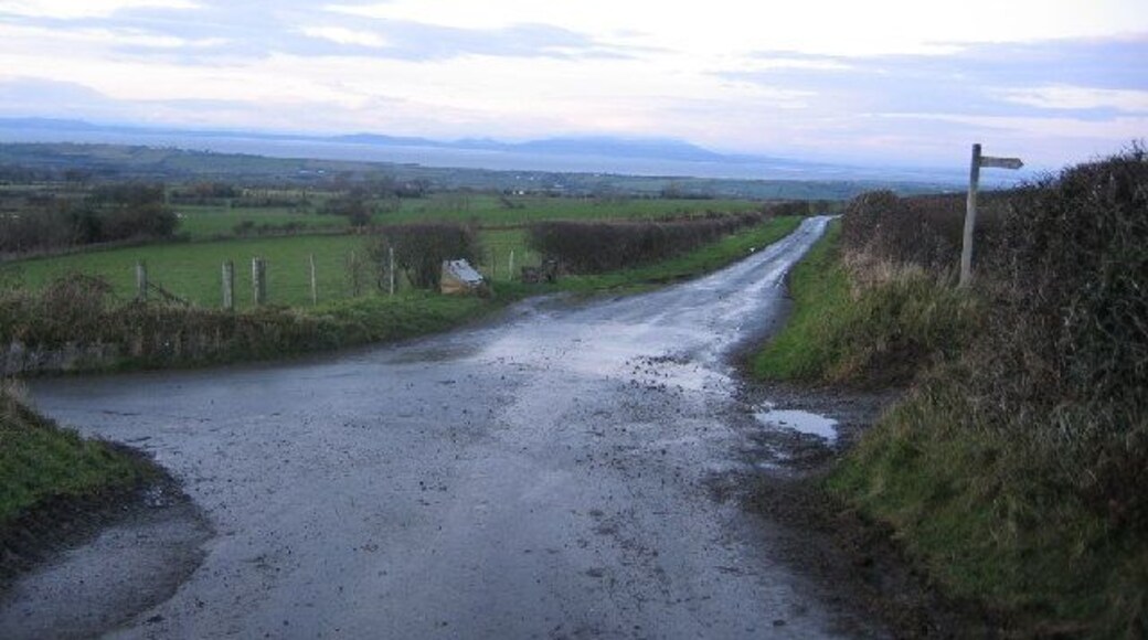 Crossroads and Scotland. The crossroads are the feature and the footpath stands out well but that is Scotland across the Solway in the background.