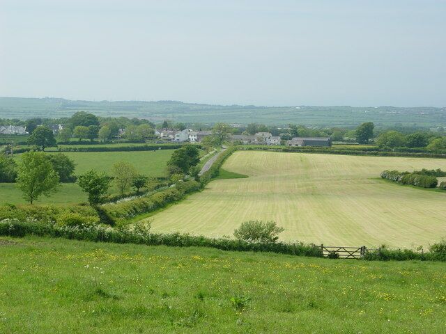 Haytime on Tallentire Hill. The expression "haytiming" is often used instead of "haymaking" in Cumbria. Here, in early June, the first cutting is underway.