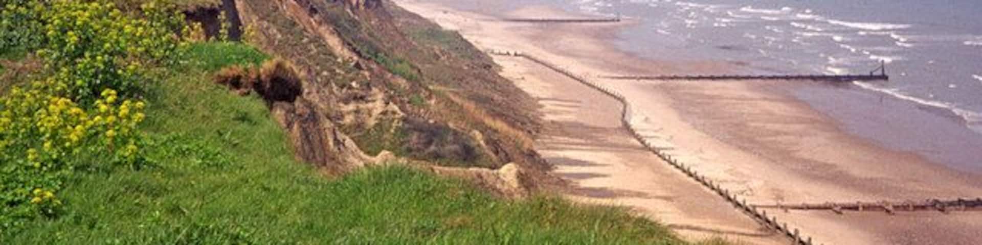 Looking towards Cromer from Overstrand, Norfolk Here we have the beach between Overstrand and Cromer with Cromer Pier on the horizon and the Cromer lighthouse just visible to the left of the Pier.