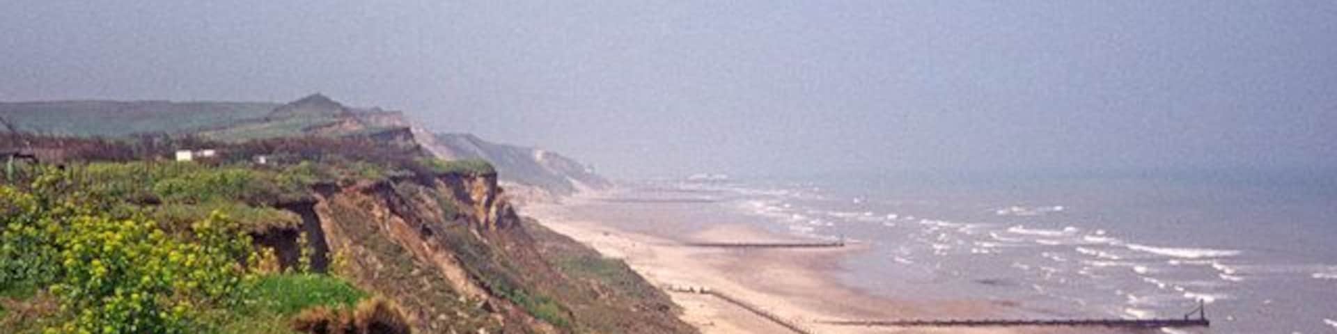 Looking towards Cromer from Overstrand, Norfolk Here we have the beach between Overstrand and Cromer with Cromer Pier on the horizon and the Cromer lighthouse just visible to the left of the Pier.