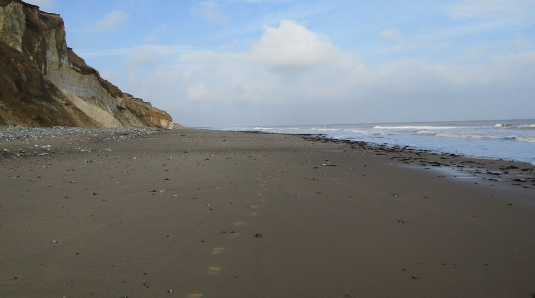 Looking west towards West Runton along East Runton Beach in the village of East Runton, Norfolk, England.