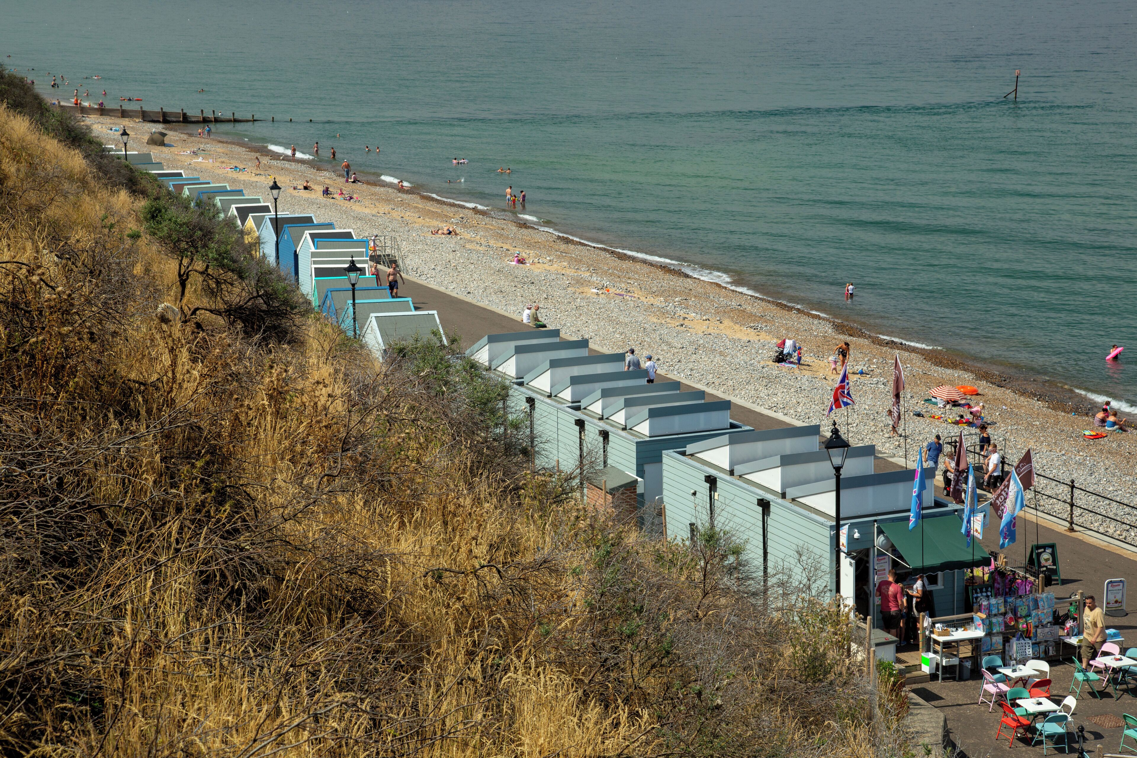 View from the steps halfway up the cliff, goats roam the cliff.