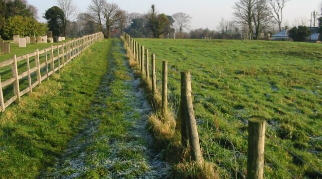 Path towards Church Lane The path runs alongside the churchyard.