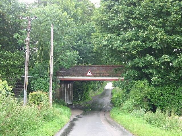 View along Sutton Lane under the railway bridge