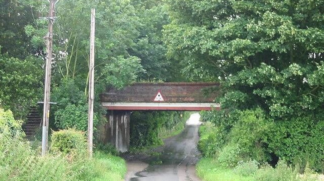 View along Sutton Lane under the railway bridge