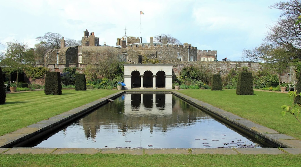 Built during the reign of King Henry VIII, Walmer Castle is one of the most fascinating visitor attractions in the South East. Originally designed as part of a chain of coastal artillery defences it evolved into the official residence of the Lord Warden of the Cinque Ports. The Duke of Wellington held the post for 23 years and enjoyed his time spent at the castle and in recent years Her Majesty Queen Elizabeth the Queen Mother made regular visits to the castle. The armchair in which Wellington died and an original pair of 'Wellington boots' along with some of the rooms used by the Queen Mother are among the highlights. And with the magnificent gardens, a woodland walk and some excellent bird spotting there's something for everyone to enjoy. There is also a pleasant cycle path along the beach front to nearby Deal Castle.