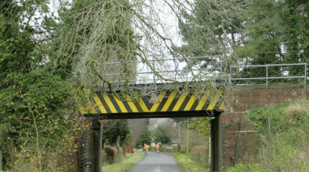 Railway bridge over Lower Road Near Erlestoke. The bridge carries the main line between Westbury, Newbury and Reading. Network Rail maintenance workers are preparing for a line inspection. The heavier stone trains were travelling slower than usual here.