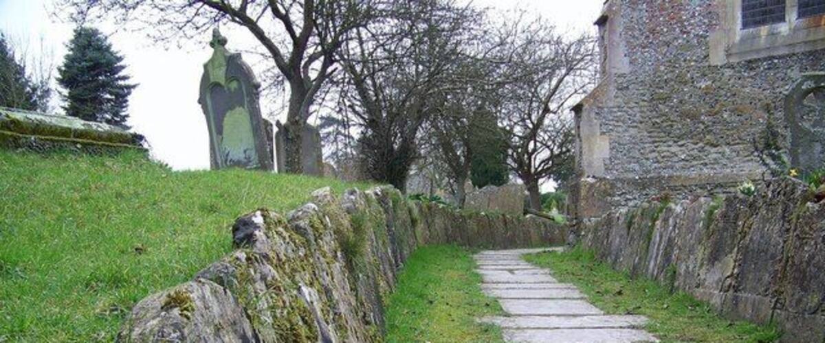 Gravestones at St Peter's Church, Great Cheverell Ancient gravestones line the path to the church porch.