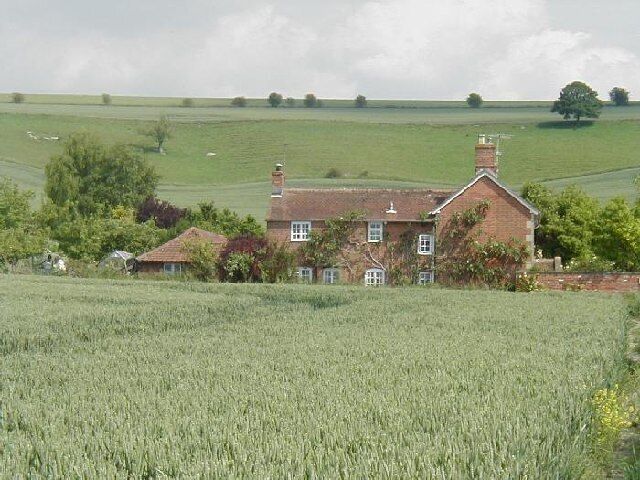 Clays Farm, Easterton. The chalk hills of Salisbury Plain rise up behind Clays Farm