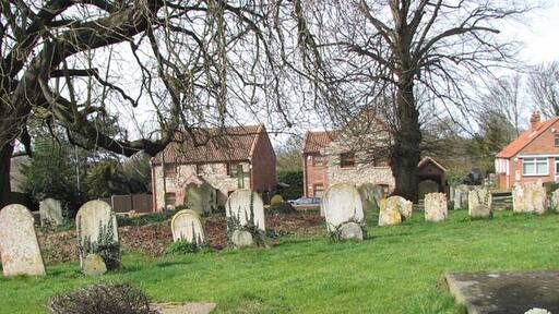 Houses in Norwich Road. Viewed across St Andrew's > 1766120 churchyard.
