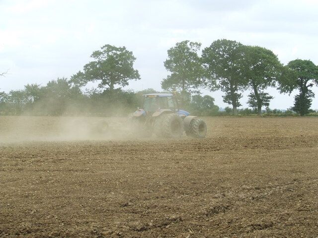 Working The Land It may be Sunday but farm work has to go on as seen near to Weybread Suffolk.