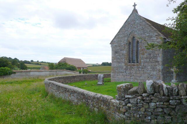 Whitcombe Church and Barn, near to Whitcombe, Dorset, Great Britain. The large thatched barn on the north side of the hamlet has recently been completely renovated along with all the houses.