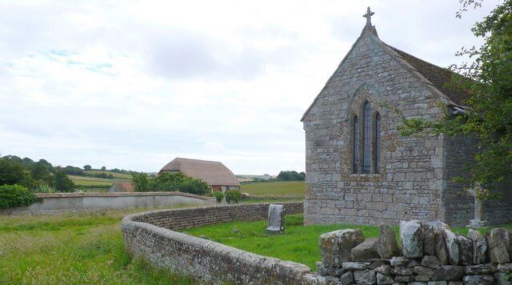 Whitcombe Church and Barn, near to Whitcombe, Dorset, Great Britain. The large thatched barn on the north side of the hamlet has recently been completely renovated along with all the houses.