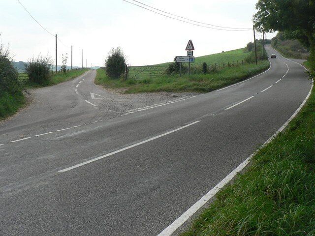Toller Fratrum: the only road in the village The turn-off for Toller Fratrum (see SY5797). The village is at the end of this lane, marked on the signpost as ¾ mile away, with a 14-foot height limit, owing to the bridge carrying the old railway, ½ mile down, meaning that nothing over that height can get to the village by public road!