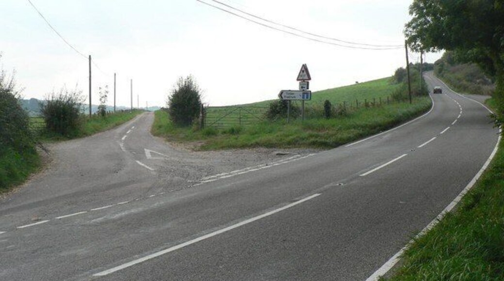Toller Fratrum: the only road in the village The turn-off for Toller Fratrum (see SY5797). The village is at the end of this lane, marked on the signpost as ¾ mile away, with a 14-foot height limit, owing to the bridge carrying the old railway, ½ mile down, meaning that nothing over that height can get to the village by public road!