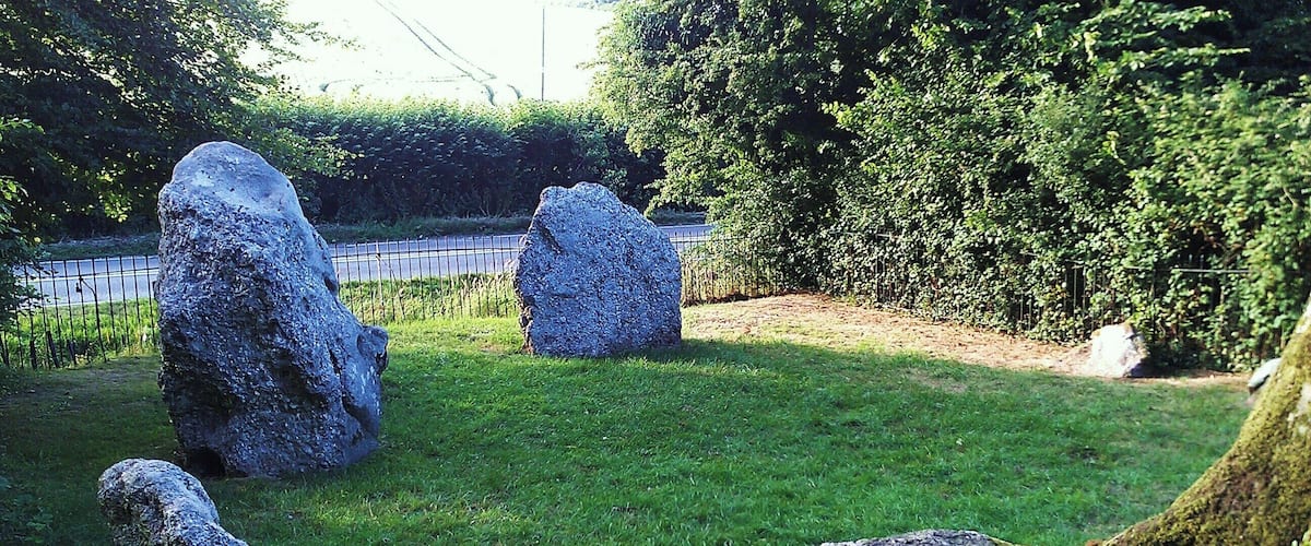 A grassy area with several large standing stones.