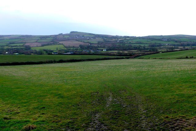 Countryside near Litton Cheney View SW across the square from just east of Pins Knoll. In the distance can be seen the prominent hill of the Knoll just behind the village of Puncknowle.