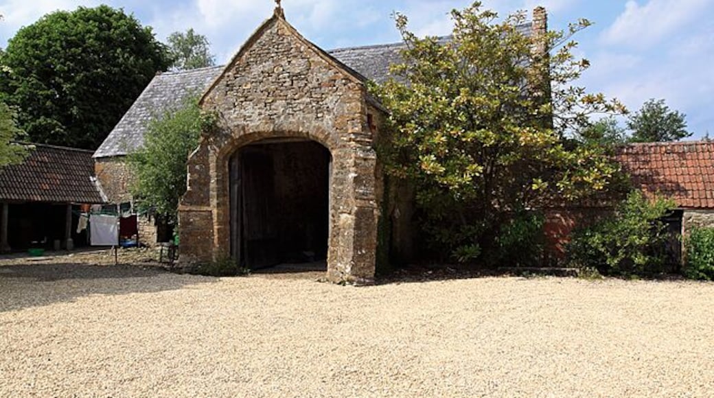 Corscombe Court Tithe Barn The tithe barn is ambiguously marked on the OS map, but lies just 40 metres northwest of the farmhouse within the courtyard behind the house. There is evidence that the whole site including the house was at one time surrounded by a moat. The barn is also grade II* listed.