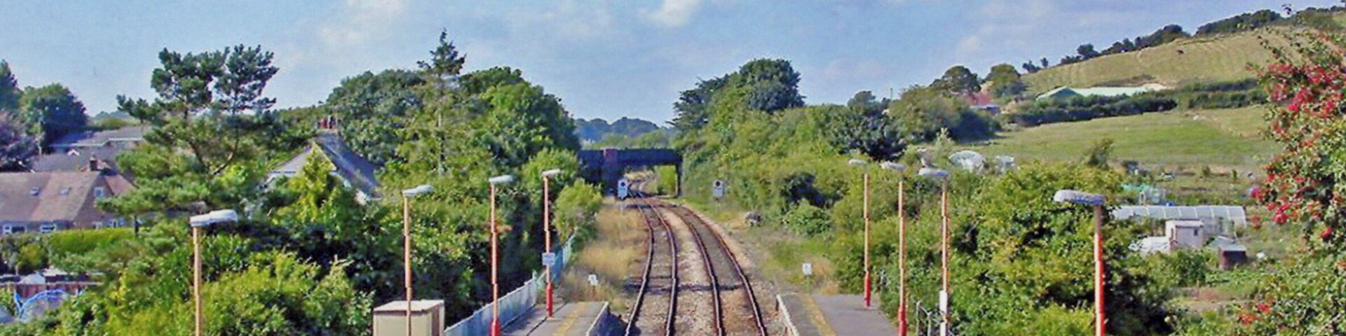 Maiden Newton station. View NW, towards Yeovil, Westbury etc., also formerly Bridport: ex-GWR (London, Reading, Swindon etc.) - Westbury - Yeovil (Pen Mill) - Dorchester - Weymouth main line. Formerly this was the junction for Bridport, closed 5/5/75 after earlier 3/12/62 closure of the line to Bridport West Bay