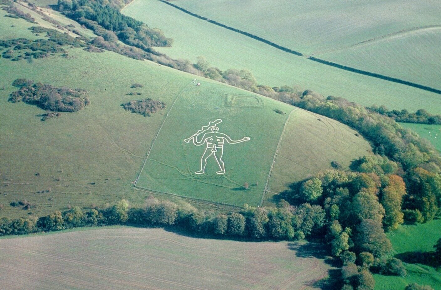 An aerial photograph of the Cerne Abbas Giant taken from a Cessna 150 aircraft using a Nikon F70, AF Nikkor 35-80mm on Fujichrome Velvia stock.