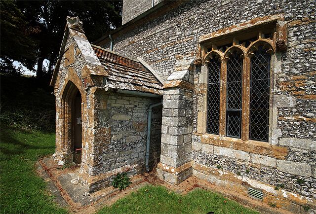 South Porch and Window Parish Church of St Martin - Cheselbourne The south porch with its sundial above the entrance arch was added in c.1500.