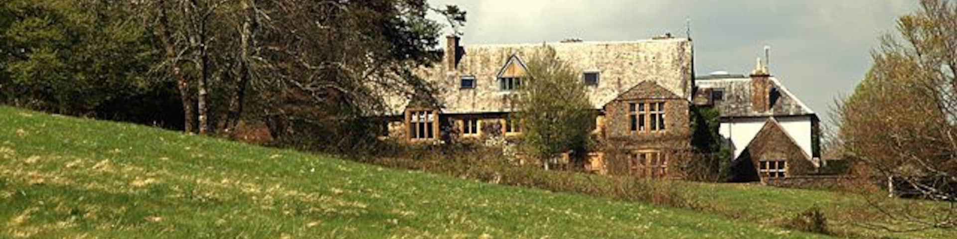 Lewcombe Manor House, East Chelborough A distant shot of Lewcombe manor house from the public footpath. Dating from the late C18, the house is grade II listed.