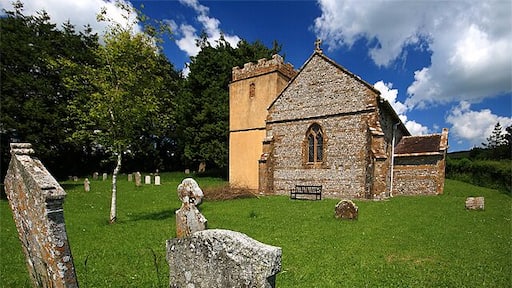 Parish Church of St Mary Frome St Quinton Partly C13, with a C14 tower, the church is undistinguished inside, due to a particularly ruthless restoration in 1879.
