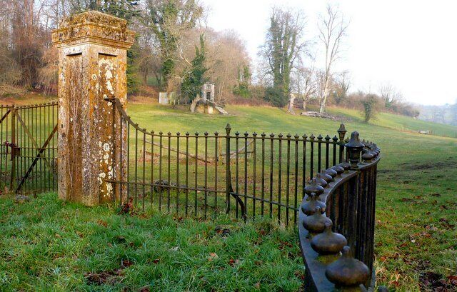Park Entrance, Piddletrenthide. This is the main gateway to the parkland associated with the manor house in the village. The house is on the west side of the road the parkland on the east. There are several follies in the park such as the one visible.