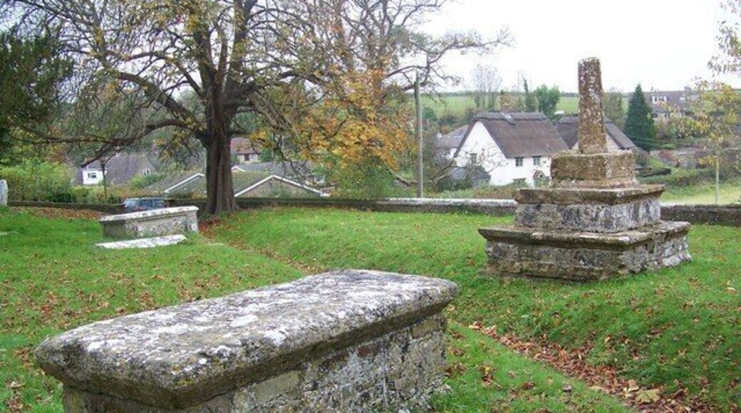 Churchyard, St Martin's Church, Cheselbourne Near the porch is the ramins of a 15th century cross and a table tomb which was used as a 'dole table'.