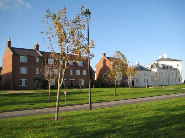 Middle Farm Way - Poundbury Having left the Briport Road further west as a detour, Middle Farm Way now leads back to a roundabout onto the same road but nearer Dorchester. There are many new houses being built along its way.