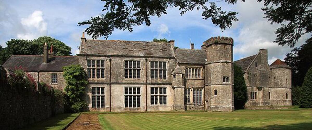 Wolfeton House South Front A rough track leads off the main Dorchester - Yeovil road at the end of which is a magnificent C16 manor house. Like many such houses, it has had quite a chequered architectural history, with the oldest surviving parts, being the south front completed in 1528, and the gatehouse (extreme right), dating from 1534. The ancestral home of the Trenchard family, it survives today having been rescued from dereliction by the present owners. Grade I Listed.
