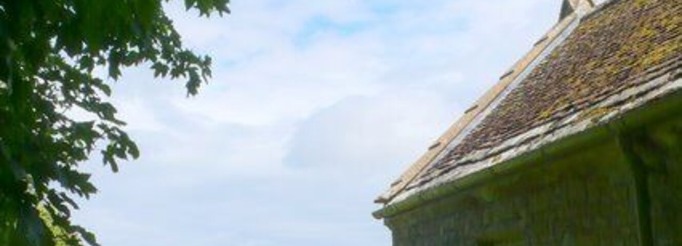 Whitcombe Church, near to Whitcombe, Dorset, Great Britain. View looking east along the north side of the church