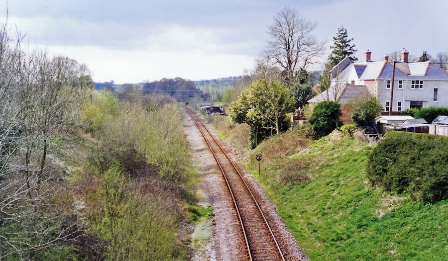 Site of Evershot station, 1995. View southward, towards Dorchester and Weymouth: ex-GWR (London, Bristol etc.) - Westbury - Yeovil - Dorchester - Weymouth main line. The station was closed 3/10/66 and the line singled about that time. This was the summit of a stiff climb in both directions.