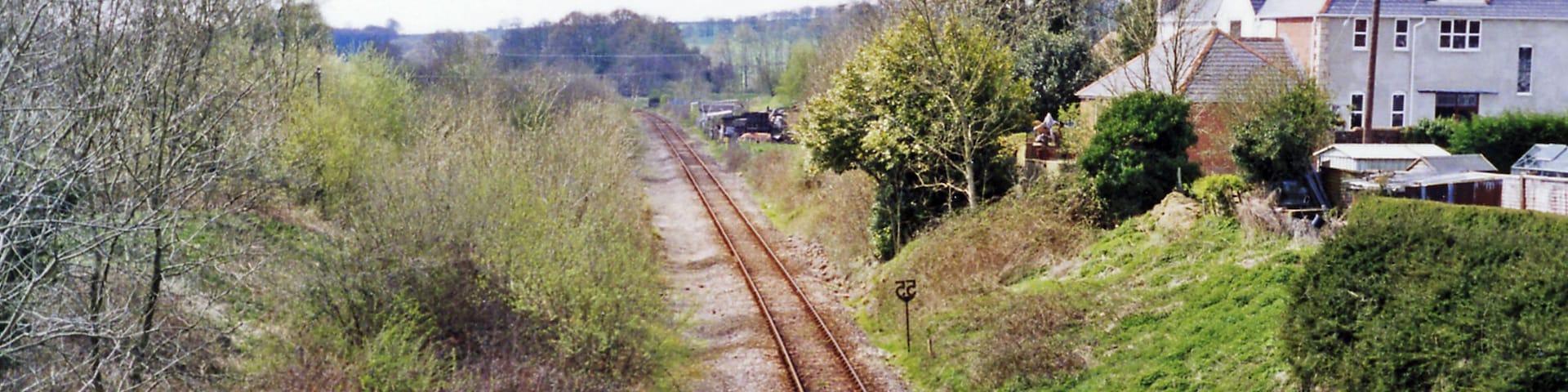 Site of Evershot station, 1995. View southward, towards Dorchester and Weymouth: ex-GWR (London, Bristol etc.) - Westbury - Yeovil - Dorchester - Weymouth main line. The station was closed 3/10/66 and the line singled about that time. This was the summit of a stiff climb in both directions.