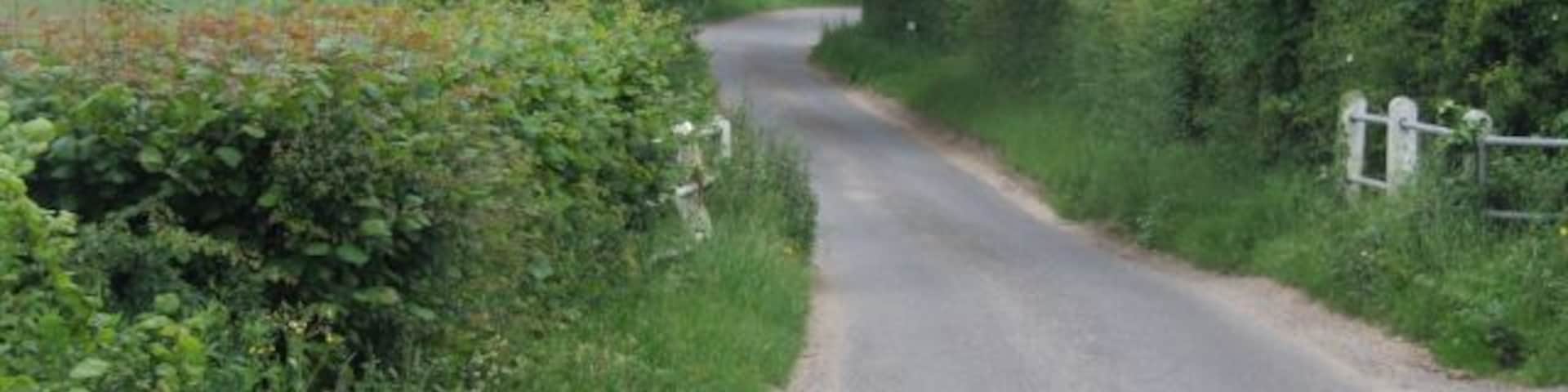 Westfield Lane crosses the River Tud The large buildings in the distance belong to Greenwood Farm, Westfield.