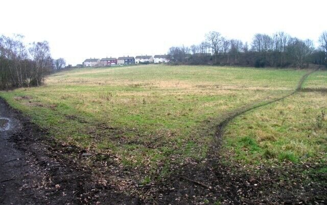 Parrow Bank A favourite spot for sledging for many years. About 40 years ago the ground between the track and the grass was raised to the level of the embankment of the Penny Engine Line removing an abrupt end to a brisk sledge run. The houses in the distance are part of the Castle Hill housing estate built in the early 1950s by the National Coal Board.