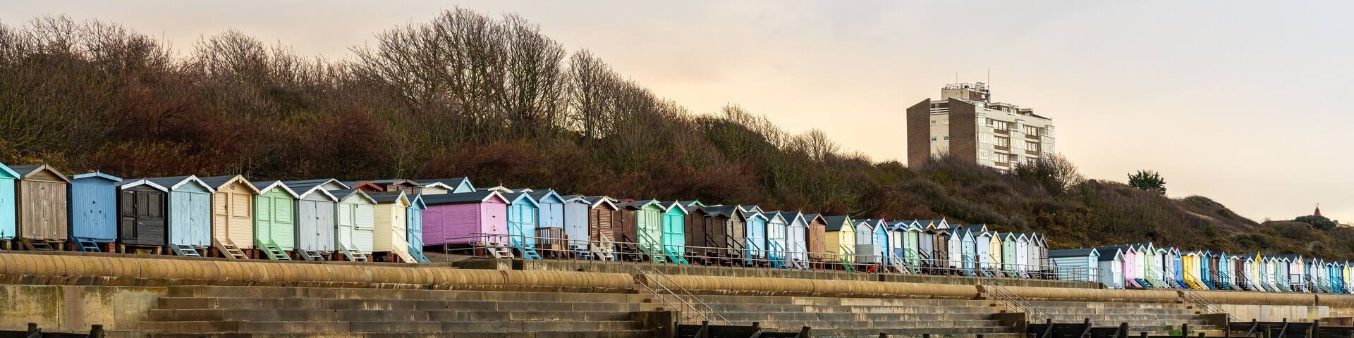 Beach huts on the North Sea coast at Frinton-on-Sea, Essex, England