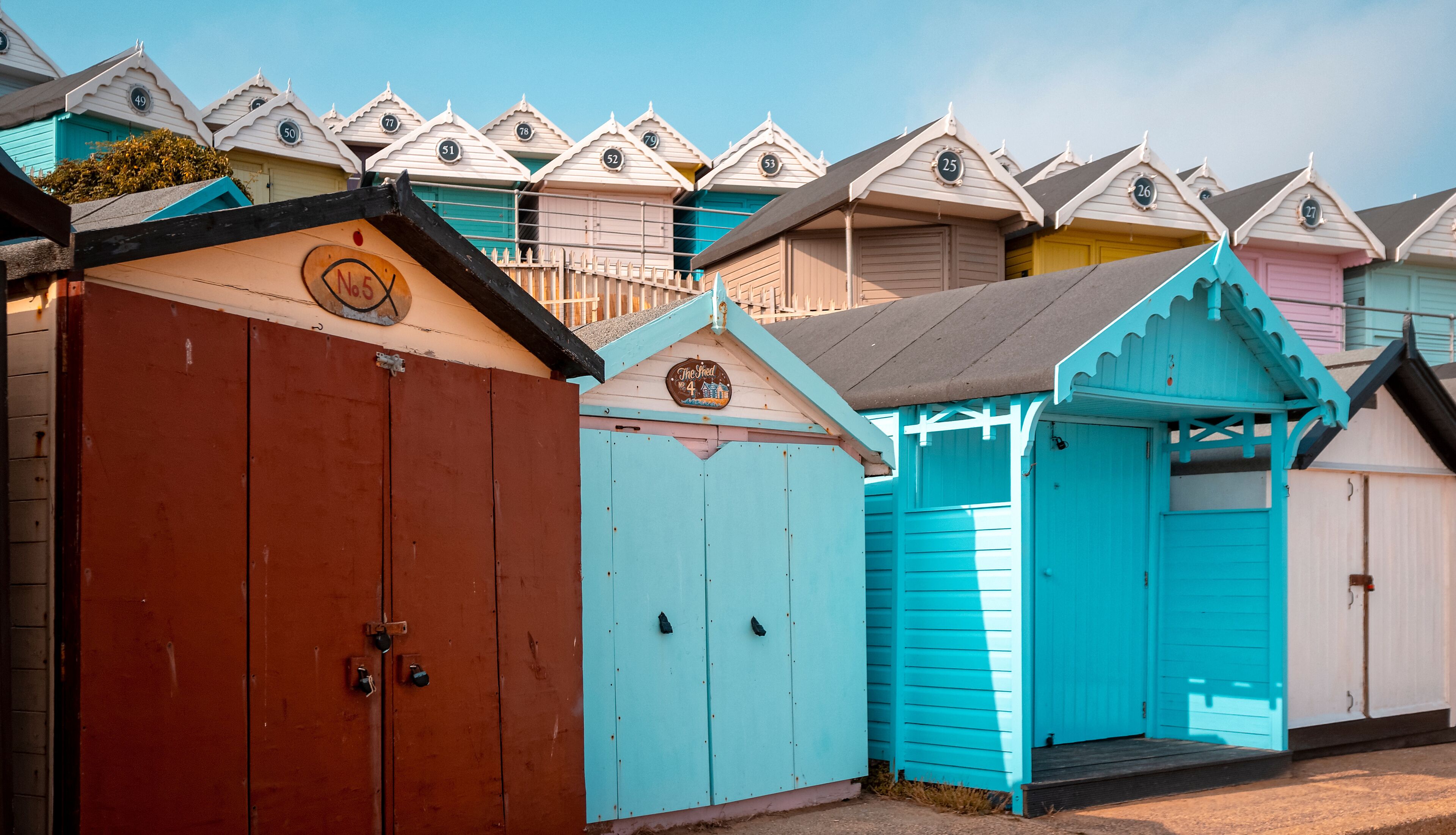 Row of Closed Beach Huts, Walton Pier, Walton-on-the-Naze, Essex, England