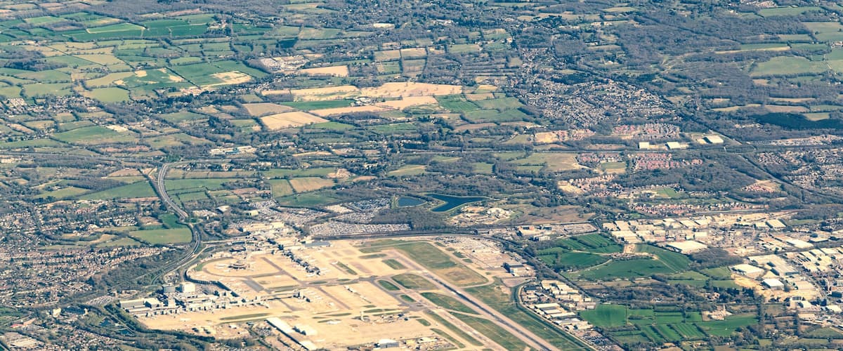 Aerial view of Gatwick Airport and the surrounding towns, villages and countryside of West Sussex in England