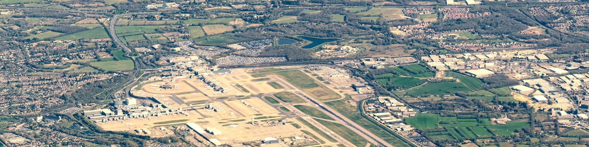 Aerial view of Gatwick Airport and the surrounding towns, villages and countryside of West Sussex in England