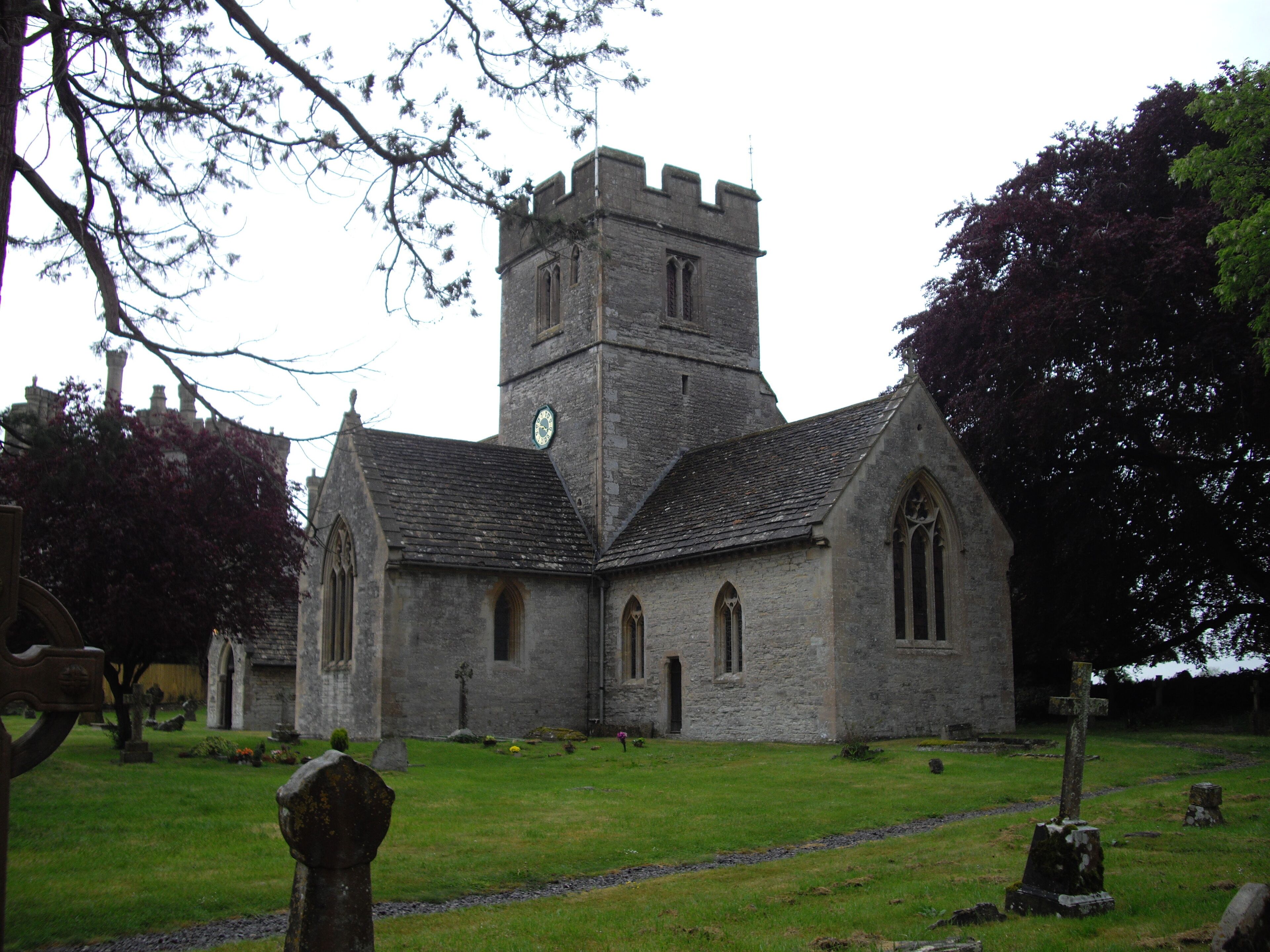 A historic church with a tall tower and arched windows.
