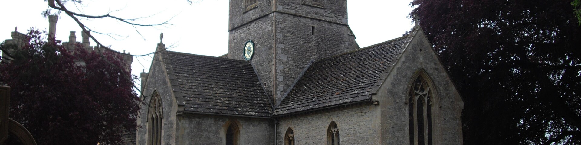 A historic church with a tall tower and arched windows.