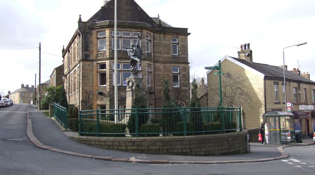 Hadfield is a village in Longdendale Derbyshire on the edge of Greater Manchester. The war memorial is similar to that in Glossop Camera location 53° 27′ 41.4″ N, 1° 57′ 57.24″ W View this and other nearby images on: OpenStreetMap - Google Earth 53.461500; -1.965900