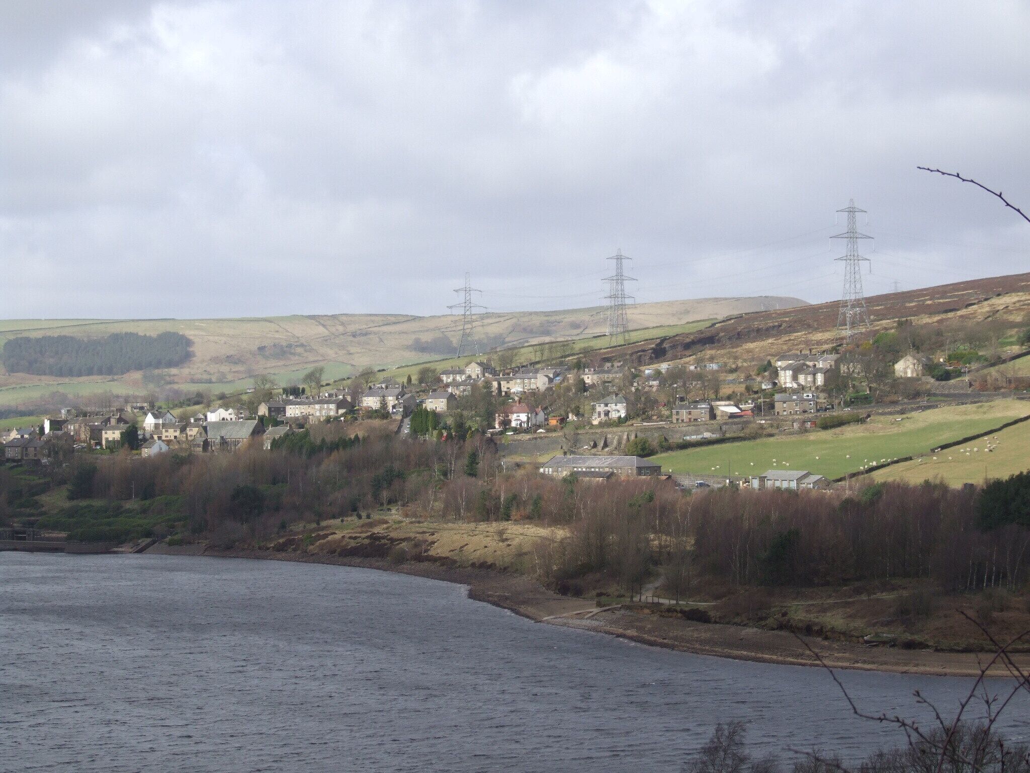 Longdendale in Derbyshire is the valley of the River Etherow. The Longdendale Chain is a series orf reservoirs built to provide drinking water forManchester Tintwistle over the Bottoms resevoir, with Lees Hill in the distance. Camera location 53° 28′ 01.92″ N, 1° 57′ 20.52″ W View this and other nearby images on: OpenStreetMap - Google Earth 53.467200; -1.955700