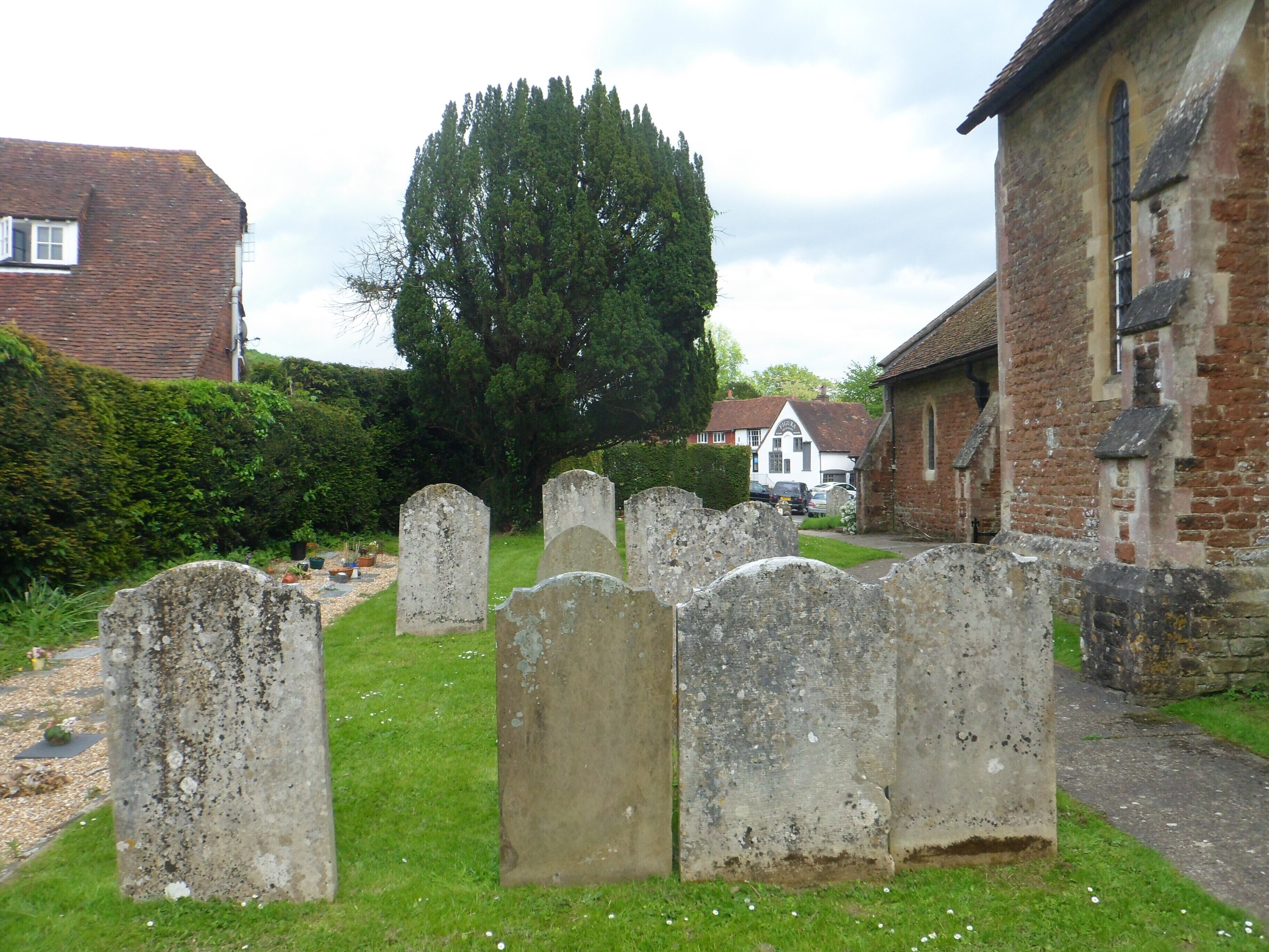 St Mary's Church, Petworth Road, Chiddingfold, Borough of Waverley, Surrey, England. This view shows part of the churchyard.