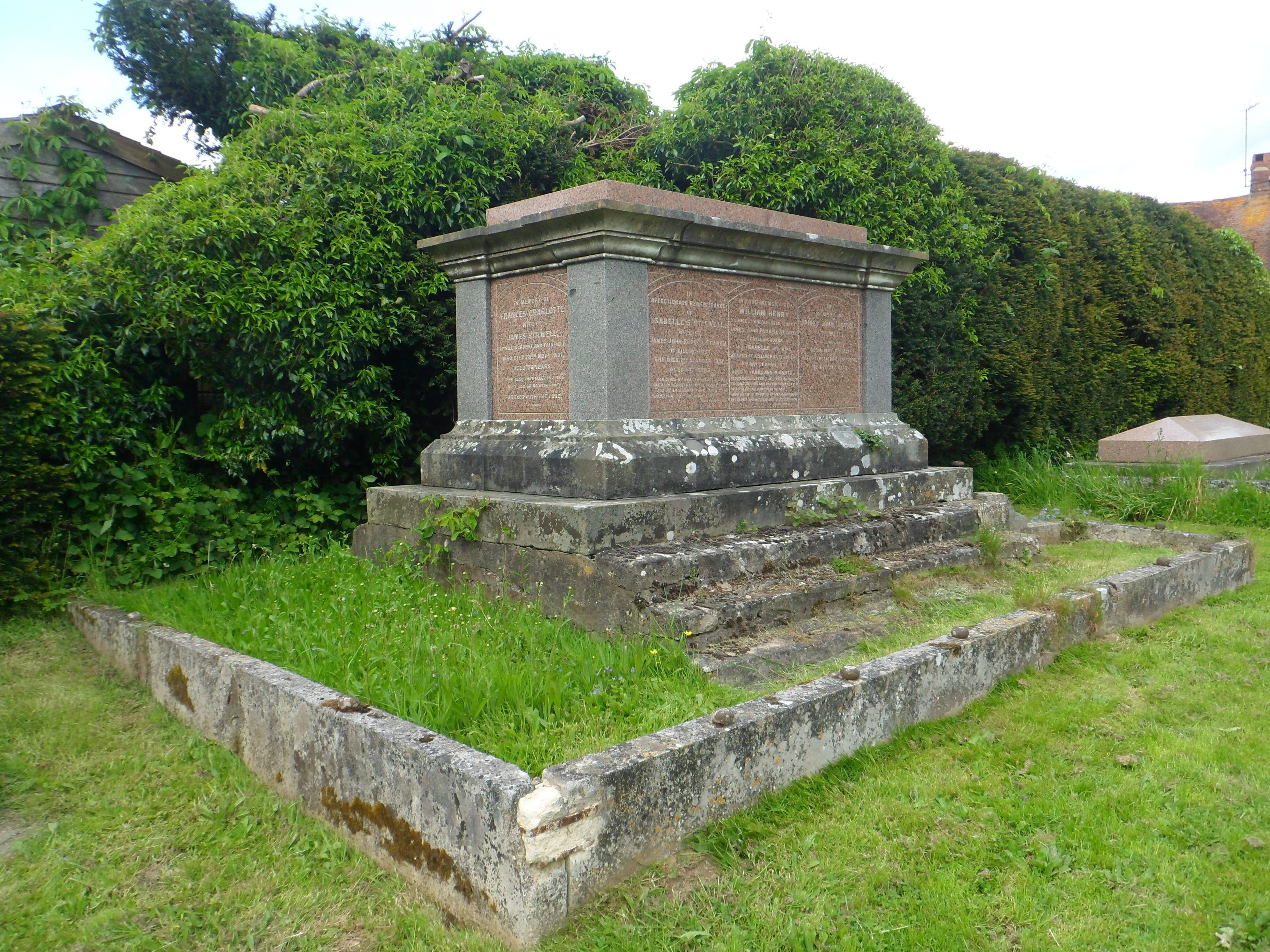 St Mary's Church, Petworth Road, Chiddingfold, Borough of Waverley, Surrey, England. This view shows the Stilwell family tomb in the churchyard.