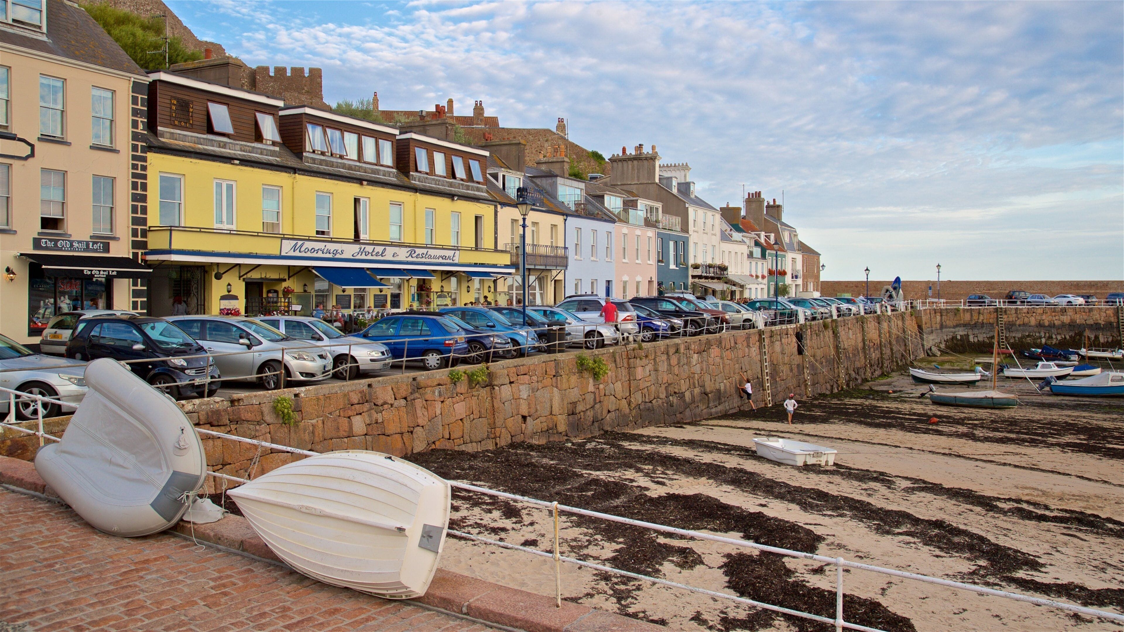 Gorey which includes a coastal town and a bay or harbor