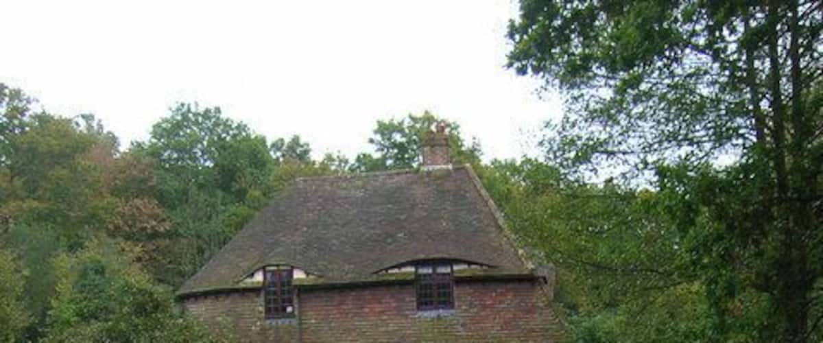 Cottage, Weavers Wood On the junction of Whitehouse Lane and Ragged Dog Lane with Whitehouse Gill hrading south to feed the Cuckmere.