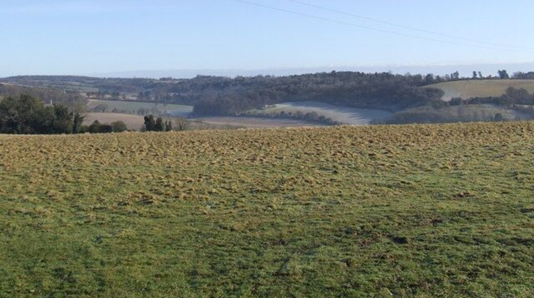 View from Common land at Bix This is the view from a field gate at the north east edge of Common land adjacent to White Lane at Bix. Looking east across the field is the valley at Middle Assendon. Fawley Bottom Lane is to the left of the clump of woods in the centre of the picture and Fawley Bottom somewhere further in the distance.