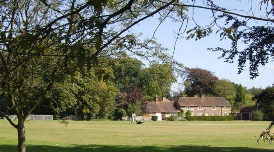 Preparing the pitch One of the last cricket matches of the season, and the groundsman is out with his mower preparing the pitch for this afternoon's match. Grey's Green cricket pitch covers the corner of four squares; the intersection must be on a good length to a right-handed batsmen facing bowling from the Shepherd's Green end.